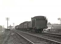 Ex-Caledonian 0-6-0 Dock Tank 56153 passes Scotstoun East station at the head of a down goods on 9 August 1957, with the crew posing for the photographer.  <br><br>[G H Robin collection by courtesy of the Mitchell Library, Glasgow 09/08/1957]