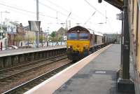 EWS 66165 brings an eastbound coal train from Hunterston Import Terminal  through platform 1 at Saltcoats station on 17 May 2007 on its way to Longannet power station.<br><br>[John Furnevel 17/05/2007]