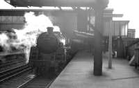 The 11.am service to Glasgow St Enoch awaiting its departure time at Carlisle platform 3 on 11 April 1964. The locomotive is Polmadie shed's Standard class 5 4-6-0 no 73076.<br><br>[K A Gray 11/04/1964]