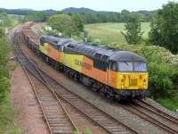 Colas 56078 and 56113 pass Inverkeithing East Junction on 5 July with a Moy - Millerhill ballast.<br><br>[Bill Roberton 05/07/2015]