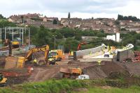 A Class 67 locomotive running light passes the Bargeddie Bridge construction site on 8th July 2015. The plant for moving the bridge to its final location is now in place below the structure itself.<br><br>[Colin McDonald 08/07/2015]