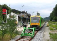 A typical scene from a German branch line today, with formerly extensive infrastructure replaced by basic fit-for-purpose provision, and loco-hauled trains replaced by single-unit modern railcars, in this case one of the widely-used Stadler Regioshuttle variants. This is the terminus of the Zwiesel-Grafenau line in the Bayerischer Wald, operated by Waldbahn (over DB Netz metals) on a one-train-working basis, seen here on 19th June.<br><br>[David Spaven 19/06/2015]