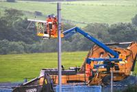 Contractors dismantling OHLE equipment on 11th July 2015, the first day of the 2 week line closure for the installation of the new viaduct.<br><br>[Colin McDonald 11/07/2015]