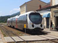 A train from Ajaccio arrives at Corte from the south on 10 July 2015. It is waiting for a southbound service to clear the single line before proceeding.<br><br>[John Thorn 10/07/2015]