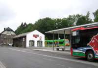 Classic German bus-rail integration at Grafenau in the Bayerischer Wald, seen here on 21st June. Ironically, the bus is operated by the Deutsche Bahn subsidiary Ostbayern Bus, while the train is operated by the private Waldbahn company.<br><br>[David Spaven 21/06/2015]