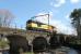 A Colas light engine working from Doncaster to Carlisle on 19th April was routed via Copy Pit and Preston rather than the S&C. This brought the unusual sight of a Class 60 on the WCML (although they have since become regular performers on the Chirk log trains). Recently refurbished 60002 is seen here crossing the River Wyre on the six arch bridge at Scorton.<br><br>[Mark Bartlett 19/04/2015]