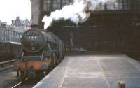 Black 5 44952 awaiting its departure time at Edinburgh's Princes Street station on 24 July 1964 with a train for Carstairs.<br><br>[John Robin 24/07/1964]