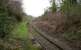 This disused section of the platform at Minffordd continues on the south side of the overbridge carrying the road and the Ffestiniog line over the Cambrian coast line. Photographed in April 2015. [Ref query 4710]<br><br>[Colin McDonald 13/04/2015]