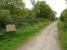 Looking south as the Cheddar Valley trackbed footpath and cycleway continue to the right at the point, just south of Congresbury Station, where the Wrington Vale Light Railway branch turned off the main line. The branch ran to the left of the spindly silver birch at the centre top of the picture. [See image 51244]<br><br>[David Pesterfield 10/05/2015]