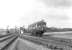 A Park Royal Railbus passing south through Dalrymple Junction on 6 August 1960 on its way from Kilmarnock to Dalmellington.  <br><br>[G H Robin collection by courtesy of the Mitchell Library, Glasgow 06/08/1960]