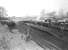General view over Largs station on 27 February 1954, as Fowler 2P 4-4-0 no 40608 prepares to get underway with a train for Glasgow St Enoch. <I>Editor's footnote</I>: Additional info from Colin Miller points out on the far right <I>The Old Engine</I>, a stationary boiler that was probably from an old 0-6-0 and mounted on a brick base with timber hut attached for the fireman. It is actually steaming in this picture, supplying heat for the rake of coaches. Its predecessor was a G&SW 4-6-4T. Any photos of the Largs stationary boilers would be welcomed for Railscot publication. <br>
<br><br>[G H Robin collection by courtesy of the Mitchell Library, Glasgow 27/02/1954]