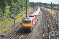 91103 leads a full Virgin liveried east coast service into York on its way from Kings Cross to Edinburgh on 18 July. The train is on the down fast line approaching Holgate Junction, seen from the Love Lane footbridge.   <br><br>[Mark Bartlett 18/07/2015]