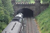 46233 <I>Duchess of Sutherland</I> enters the short artificial tunnel at Gisburn with a Cumbrian Mountain Express excursion from Liverpool on 18th July 2015. Above the castellation the northern portal can also be seen and the park land that lies in between. <br><br>[Mark Bartlett 18/07/2015]