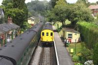 Hastings Unit 1125 arriving at Medstead on 19 July 2015 crossing a train hauled by 850 <I>Lord Nelson</I>.<br><br>[Peter Todd 19/07/2015]