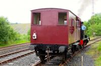 The driver of No. 10 on shuttle duties waits for the Fireless locomotive to do its run-pasts before resuming service at Dunaskin on 5 July 2015.<br><br>[Colin Miller 05/07/2015]