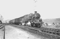 View north on 15 May 1959 as BR Standard Tank 80113 pulls away from Maud with a freight from Peterhead following a water stop alongside Maud signal box. <br><br>[G H Robin collection by courtesy of the Mitchell Library, Glasgow 15/05/1959]