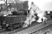Scene at Lauder on Saturday 15 November 1958, featuring St Margarets BR Standard Class 2 2-6-0 no 78049, a mere 3 years old at that time. The locomotive had arrived with the BLS <I>'Last train to Lauder'</I> from Fountainhall.  Lauder station closed to scheduled passenger services in 1932, although freight continued over the line for many years, not least serving a large WW2 Ministry of Food buffer depot built alongside Lauder station [see image 27003]. <br><br>[D Welsh Collection [Courtesy Bruce McCartney] 15/11/1958]