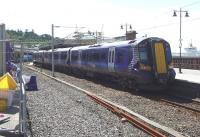 ScotRail 380017 awaits its departure from Wemyss Bay in the midday sunshine on 7 August 2015.<br><br>[John Steven 07/08/2015]