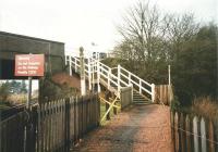 The rather homely stairs to the Up platform at Rosyth in April 1999. I imagine that post once held a notice about having your ticket ready for inspection. Arrangements here are now a little more disabled-friendly.<br><br>[David Panton 02/04/1999]