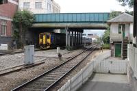 FGW Sprinter 150263 leaves Exeter Central and immediately begins the steeply graded descent to St. David's station with a service from Exmouth to Barnstaple. The signal box is no longer in use but lingers on alongside the line. <br><br>[Mark Bartlett 29/07/2015]