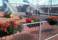 Planters maintained by 'Lockerbie in Bloom' give a welcoming appearance to this station, which is the railhead for a large area of South-West Scotland. <br><br>[John Yellowlees 17/08/2015]