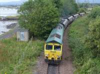 Freightliner 66550 passes through the former Kincardine Station on the banks of the Forth with coal from Hunterston High Level to Longannet Power Station on the day the latter's closure was announced for 31 March 2016.<br><br>[Bill Roberton 18/08/2015]