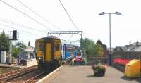 The 15.03 ex Girvan speeds through Prestwick Town on 17 August. This train runs non-stop from Ayr to Kilwinning and thence stops only at Paisley Gilmour Street prior to reaching Glasgow Central.<br><br>[Colin Miller 17/08/2015]