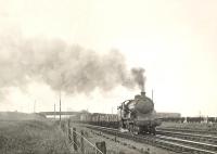 Ex-GER Holden B12 4-6-0 61526 leaving Fraserburgh with a long goods train on 7 July 1950. <br><br>[G H Robin collection by courtesy of the Mitchell Library, Glasgow 07/07/1950]
