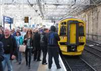 Crowds pour off the (bang-on-time) 09.40 arrival of the first ScotRail train from Tweedbank at Waverley on Sunday 6th September.<br><br>[David Spaven 06/09/2015]
