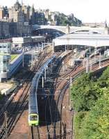 The first ScotRail train from Edinburgh to Tweedbank – the 09.11 departure on Sunday 6th September – threads its way towards Calton Tunnel. The shot continues a long Spaven family tradition of photography from this classic viewpoint [see image 27732].<br><br>[David Spaven 06/09/2015]