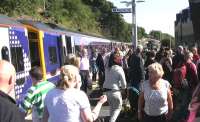 The crowds continue to enjoy the Borders Railway throughout the brilliantly sunny opening day as the 1404 from Edinburgh arrives at Galashiels on 6th September 2015.<br><br>[Colin McDonald 06/09/2015]