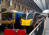 The class 365 on the left looks happy enough at Kings Cross on 2 September 2015, but the Grand Central 180, Adelante, on the right looks downright menacing.<br><br>[Ken Strachan 02/09/2015]