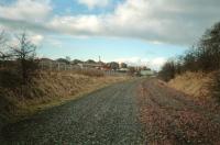 Location of Potterhill Junction looking towards Elderslie. The line from Meikleriggs Junction came in from the left. This closed in 1909 at the time when Corsebar Junction to Barrhead was singled and the signalboxes closed. The photograph was taken in 1987 a few months after the track of the closed line was lifted. [Ref query 4228] <br><br>[Ewan Crawford //1987]