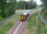 A mid morning train on the Borders Railway runs south through woodland near Arniston on 25 September 2015 heading for its next stop at Gorebridge.<br><br>[John Furnevel 25/09/2015]