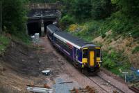 Just before passing through the tunnel under the Forth and Clyde Canal, 156449 on an Anniesland - Queen Street service passes the location of the junction for the new connection to the main line at Anniesland.<br><br>[Colin McDonald 23/09/2015]