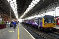 A Northern Rail service to Colne awaits its departure time at Preston station on 20 September, while passengers who had to leave an earlier service to Glasgow, await another train before they can continue their journey.<br><br>[John Steven 20/09/2015]