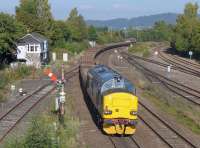 37259 brings up the rear of a steel sleeper train hauled by 66106 fro Mossend to Forsinard, and passes Stirling North 'box.<br><br>[Bill Roberton 29/09/2015]