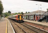 SWT 159105, on a Waterloo bound service, pulls away from the Honiton stop on 200715. Platform 2 is only used when trains have to pass here so most services use Platform 1 where the booking office and waiting room are situated. <br><br>[Mark Bartlett 20/07/2015]