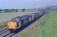 37108 'Lanarkshire Steel' and 37097 double head a loaded coal train from Hunterston to Ravenscraig in 1990.<br><br>[Ewan Crawford //1990]