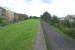 The cycle path is now well established on the trackbed of the line from Partick Central to Yoker, seen here on 18 July 2015 passing the remains of the island platform at Scotstoun East. [See Image 8607] for a similar view in 1988.<br><br>[Malcolm Chattwood 18/07/2015]