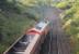 Looking towards Taunton on 25 July 2015 as DBS 59202 leaves the GWR main line at Clink Road Junction to access the Frome loop with a train of empty hoppers for Whatley Quarry. Before reaching Frome station it will fork right again for the actual quarry branch. The line running straight ahead at this point is the 1933 built <I>cut off</I> which bypassed Frome. <br><br>[Mark Bartlett 25/07/2015]