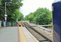 The guard of the 1054 from Plymouth changes the points at Bere Alston allowing the Sprinter to reverse and continue to Calstock and Gunnislake. This ritual has been taking place since 1970 when the old main line was singled and Bere Alston box closed. [See image 13932]<br><br>[Mark Bartlett 29/07/2015]