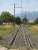 View west from the Chemin du Mas Llinas level crossing, along the electrified freight branch line running from Elne, towards Le Boulou East yard approx 1Km away, showing the trap points and short spur to deal with any runaways before they reach the level crossing. Axle counters can be seen on the left rail both before and beyond the point blade. <br><br>[David Pesterfield 05/08/2015]