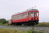 To British eyes the vehicle pictured would be a tram but is known to its owners as an interurban car.  On September 19th car 1225 leaves Cloverdale station heading towards Sullivan on the Fraser Valley Heritage Railway in Surrey, British Columbia.  Similar cars once travelled this route on the 2¾ hour 63 mile journey from New Westminster to Chilliwack.  The vehicle being propelled by the car contains a generator and rectifier to provide a 600v DC supply in the absence of overhead wires on a route which is still in daily use by freight trains.<br><br>[Malcolm Chattwood 19/09/2015]