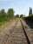 Looking east towards Le Boulou yard from the level crossing on Route de Vives, with St-Jean-Pla-de-Corts yard and the mothballed section running on to Ceret to rear of view, showing the rather weather worn sleepers on this rarely used section of line between the two yards; and also what appears to be a transition from bull head to flat bottom rail for the section through the level crossing. [See image 52696] for view in opposite direction<br><br>[David Pesterfield 05/08/2015]