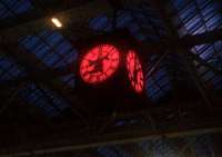 The clock at Glasgow Central has taken on rather a spooky appearance for Hallowe'en. Seen against a backdrop of the glazed roof and a darkened sky.<br><br>[John Yellowlees 26/10/2015]