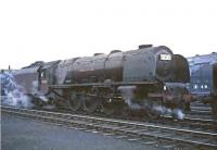 Night shift. Scene in the yard at Polmadie on a summer evening in 1964, as Stanier Pacific 46244 <I>King George VI</I> prepares to go off shed and make the short journey to Glasgow Central. The locomotive will  later take out the London sleeper. <br><br>[John Robin 17/07/1964]