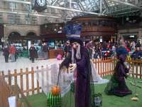 Passengers in Glasgow Central station appear to be remarkably unsurprised by an apparition in their midst on the concourse. Hallowe'en is just another day.<br><br>[John Yellowlees 26/10/2015]