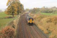Autumn colours in Ribblesdale as Northern Sprinter 150270, on a Morecambe to Leeds service, pulls away from Long Preston station on 31st October 2015. The next stop at Hellifield is only a very short distance away.<br><br>[Mark Bartlett 31/10/2015]