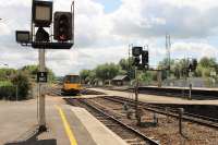 FGW Pacer 143611 approaches Exeter St Davids from Paignton and crosses over to Platform 1. From here the unit will reverse and take the left hand tracks up the steep incline to Exeter Central before continuing down the branch to Exmouth. <br><br>[Mark Bartlett 29/07/2015]